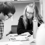Girl is teaching the guy