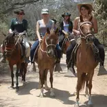 guiding the tours on horseback