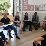 Teach English in academies.