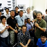 Engineering Interns taking a photo with collegue in the office