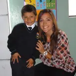Volunteer with her student after culminating a teaching English program.