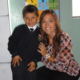 Volunteer with her student after culminating a teaching English program.