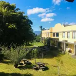 blue skies over a yellow Costa Rican building