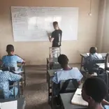 Volunteer given lesson to his students