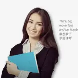 woman holding notebook and smiling in front of a white background