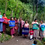 Weavers showing off their hand-woven pillows