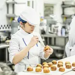 Students in the kitchen during Boulangerie program at Le Cordon Bleu