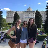 3 Horizons Abroad teen Spanish immersion students smiling in front of Madrid's Royal Palace