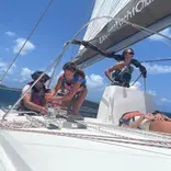 Group of teens sailing a yacht
