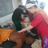 A Volunteer doing treatment by Myotherapy