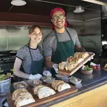 two students making empanadas