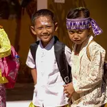 Two children going to school.