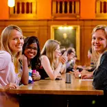 Students chatting and smiling in LMH Dining Hall