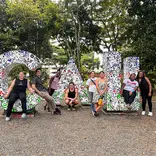 CET Colombia study abroad students pose in front of giant letters spelling "Cali"