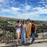 Interns walking through Madrid’s historic streets with cafes and landmarks around them