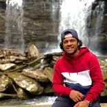 Spirit intern in front of a waterfall