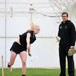 A Massey coach works with a student-athlete.