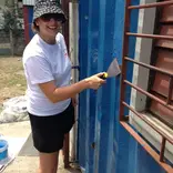 Volunteers doing building maintenance
