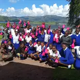 Group of school-going girls with Happy Girls Project's health kit
