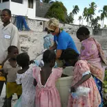 A volunteer with the kids in Haiti