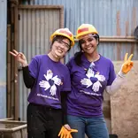 Volunteers wearing purple shirts in Nepal