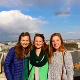 Students standing in front of the Seville skyline