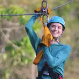 Student explore the rain forest via a zip line course in Belize