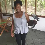 Student holding a raptor