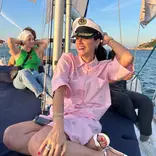 Students enjoying themselves on a sailboat in Lisbon, Portugal