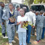 children receiving tree seedlings