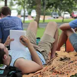 Students studying outdoors on campus