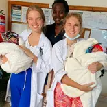 Volunteer providing hands-on medical assistance in a Tanzanian clinic