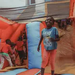 Young children jumping on a bouncing castle