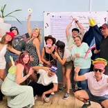 trainees in a classroom at The Language House celebrating their last day