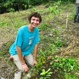 Reforestation Intern Planting Trees