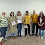 Students and teachers celebrating during the certificate distribution ceremony at the end of the course.