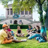 EF language year abroad students hanging out together in a central city park