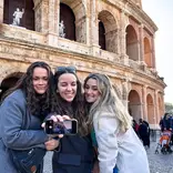 Students taking selfie in front of roman forum 