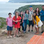 Group of students pose for photo on coast of Spain