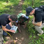Volunteers comparing footprints 