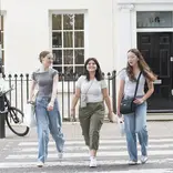 Students walking across the street in London