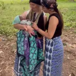 women holding child