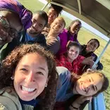 Group photo in safari vehicle.