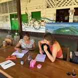 A women studying with local teacher