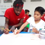 Intern working with students in Mexico
