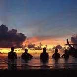 Interns swimming during the sunset in the Seychelles 