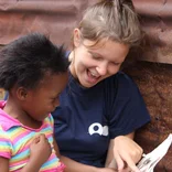 Volunteer working with a child in South Africa