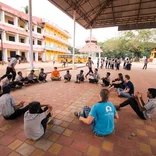 Interns playing with a group of students in India 