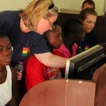 Interns teaching computer skills in Ghana
