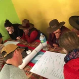 Volunteers working with community members in Peru